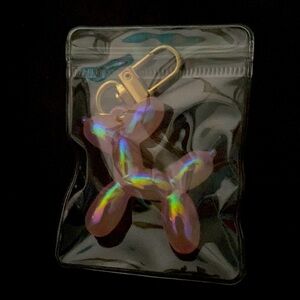 Baby pink dog keychain.